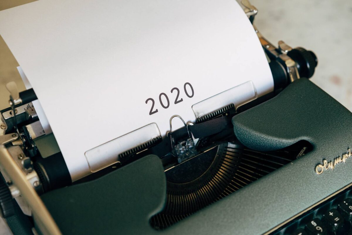 white printer paper on black typewriter